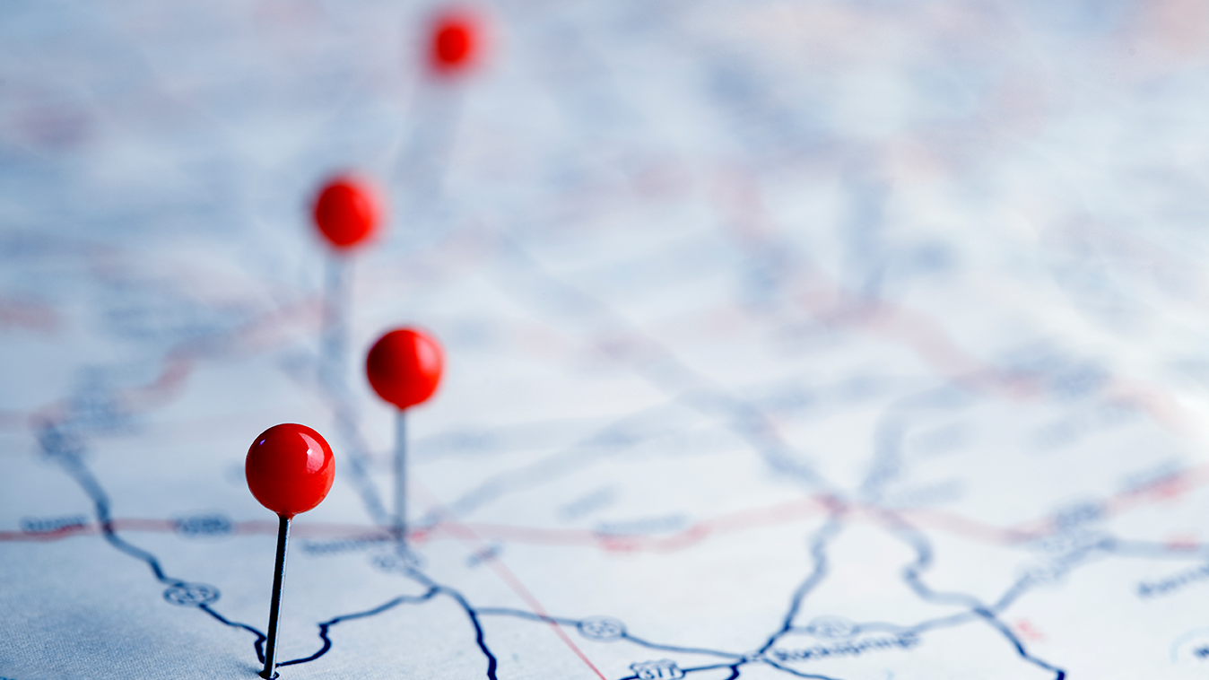 photo of map with pins in it